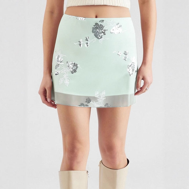Dame gjennomsiktig skjørt med floralt design og glitrende detaljer Skjora