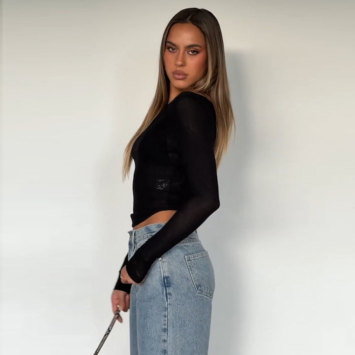 Dames langermet topp med transparent mesh-design og off-shoulder utseende