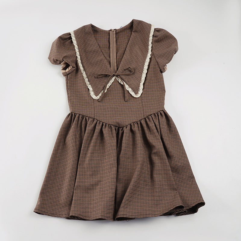 Ladies' dress with elegant collar and ruffle details Skjora