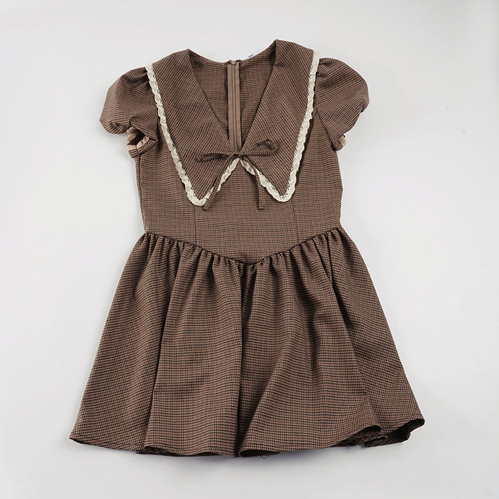 Ladies' dress with elegant collar and ruffle details Skjora