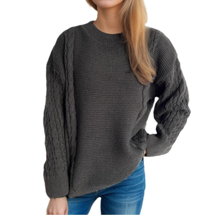 Kvinne chunky strikkegenser med kabeldesign og voluminøse ermer Skjora