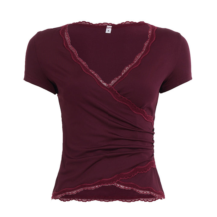 Dame omslagsbluse med elegante spissdetaljer Skjora