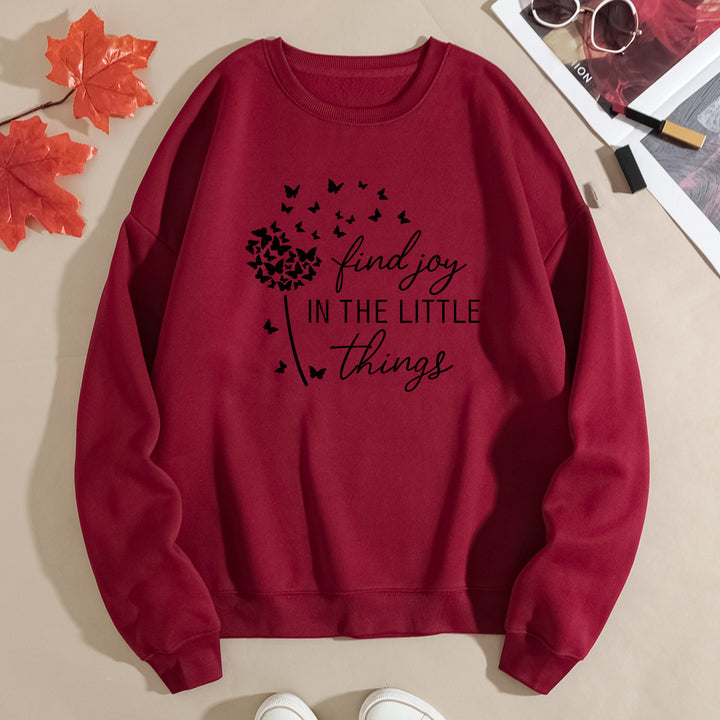 Kvinnegenser med motiverende slogan og blomsterprint Skjora