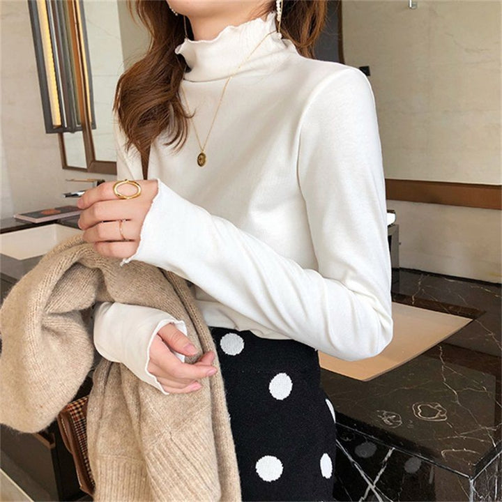 Kvinne Langermet Turtleneck Top med Fin Ribbestrikk Design og Ledig Passform