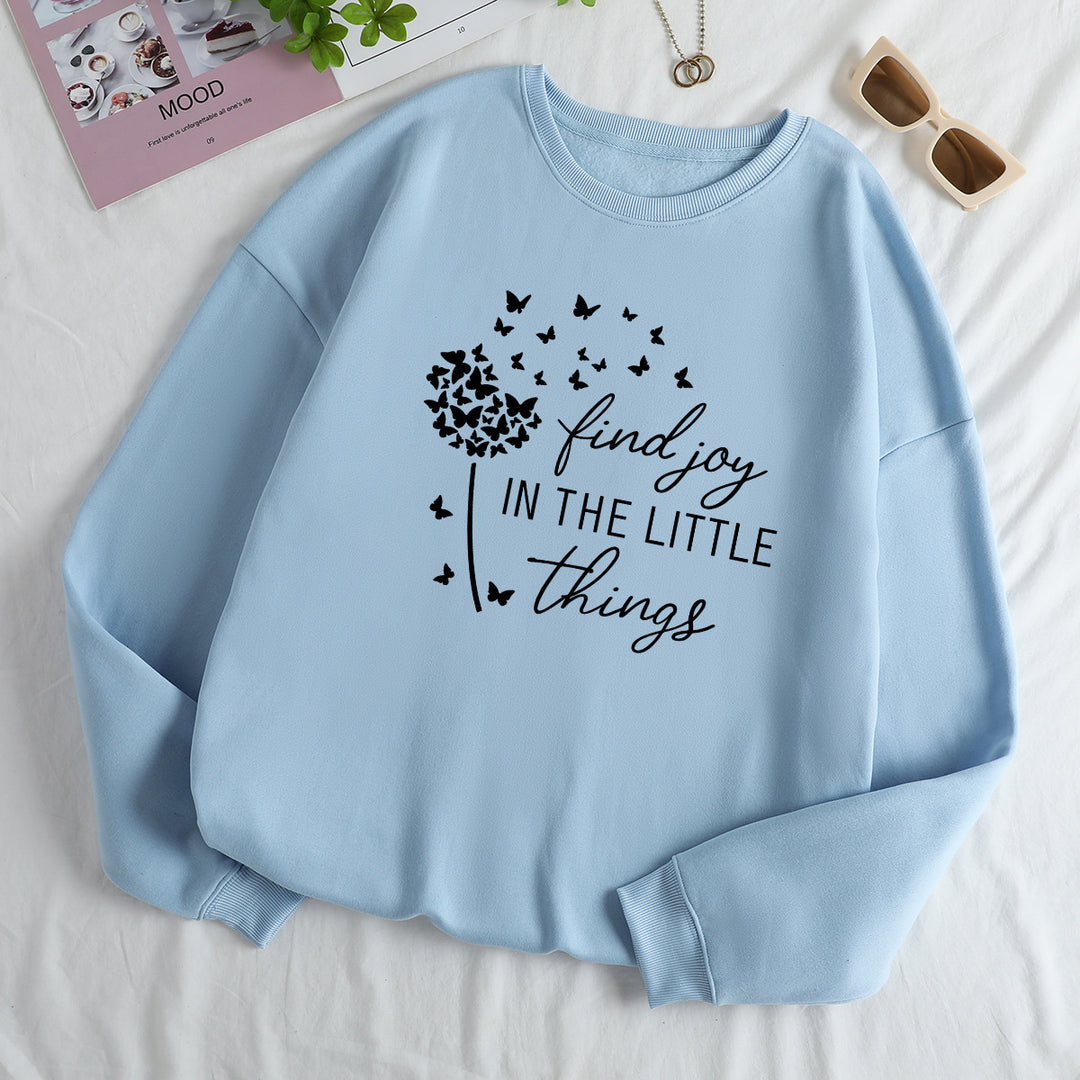 Kvinnegenser med motiverende slogan og blomsterprint Skjora