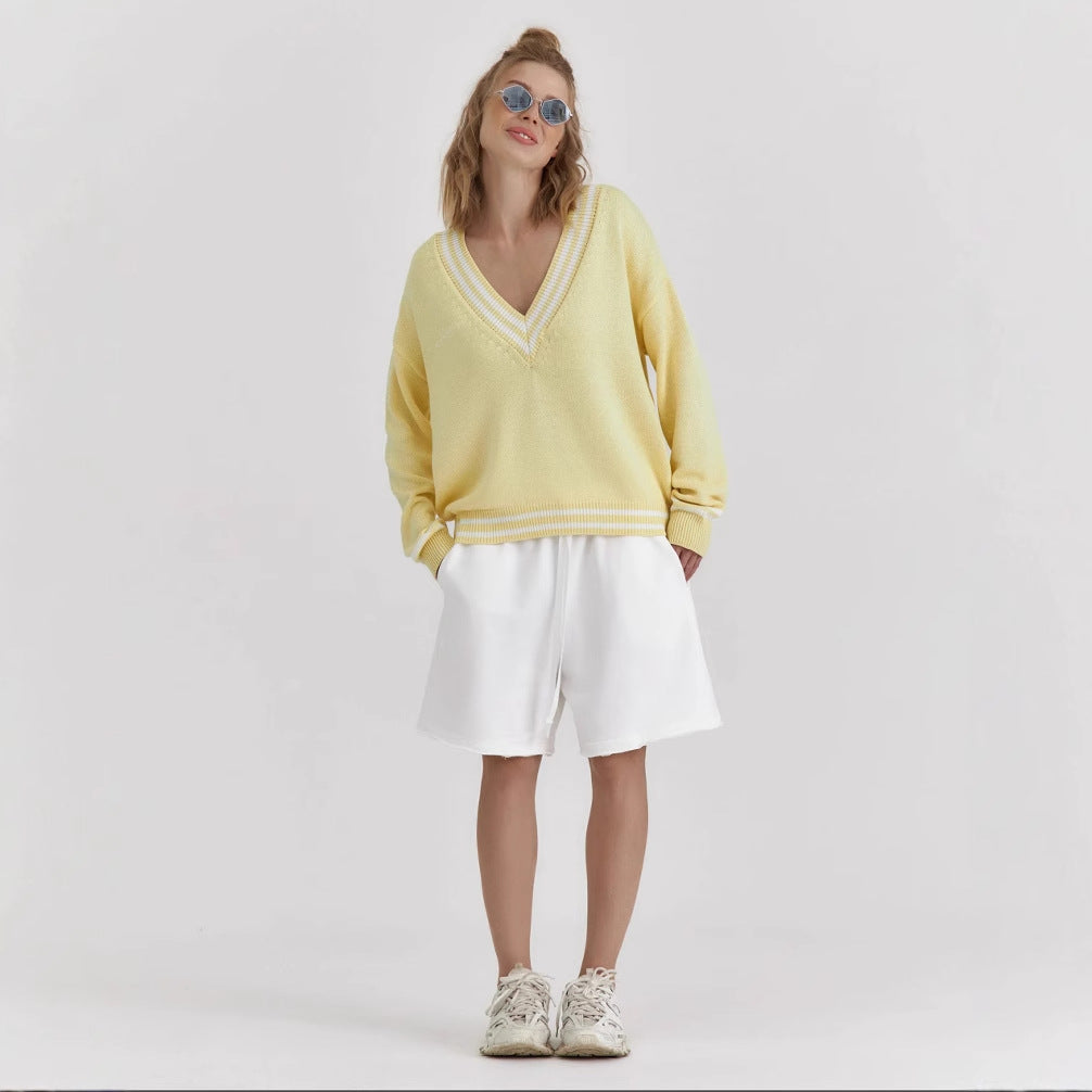 Kvinnes Oversized Strikkegenser med V-hals og Sporty Detaljer Skjora