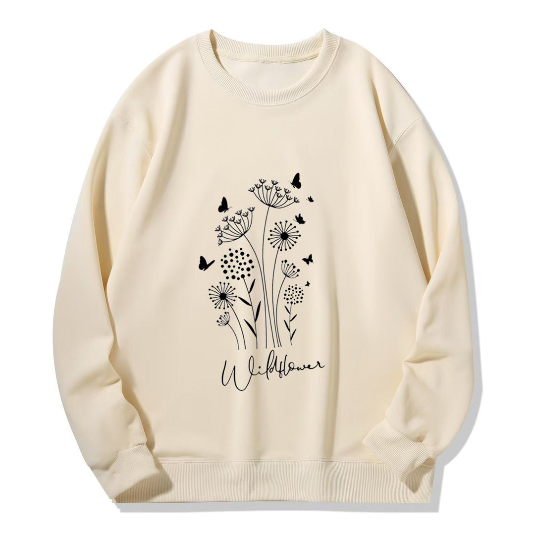 Kvinnelig sweatshirt med blomstertrykk av villblomster og koselig innerfor Skjora