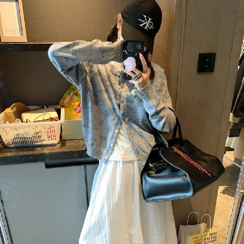 Dame cardigan med blomstermønster og knappeåpning Skjora