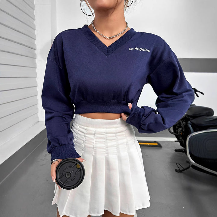 Kvinnens casual V-hals crop topp med elastisk kant og lange ermer Skjora