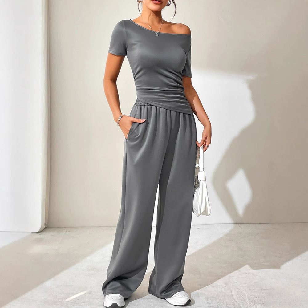 Dame jumpsuit med asymmetrisk snitt og vidbenet design Skjora