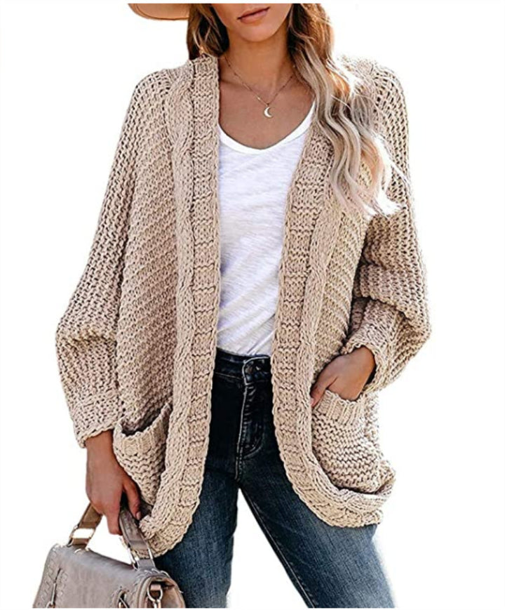 Kvinnes chunky strikk cardigan med uformelle lommer og voluminøse ermer Skjora