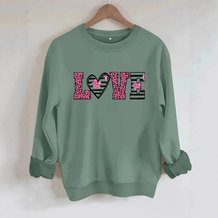 Dame sweatshirt med moderne leopard hjerte-design og behagelig passform Skjora