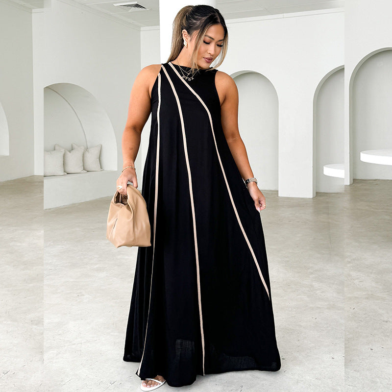 Kvinne maxi kjole med asymmetrisk design og elegante kontrast sømmer