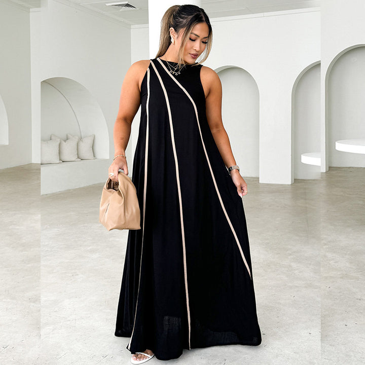 Kvinne maxi kjole med asymmetrisk design og elegante kontrast sømmer