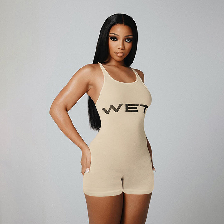 Dame Sporty jumpsuit med racerback og iøynefallende logo Skjora