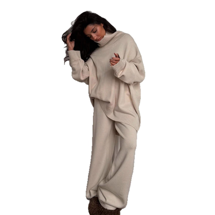 Kvinnelig oversized strikkegenser med høy krage og loose cut bukser Skjora