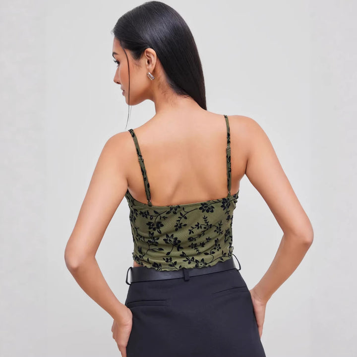 Dame spitzetop med florale aksenter og asymmetrisk snitt Skjora