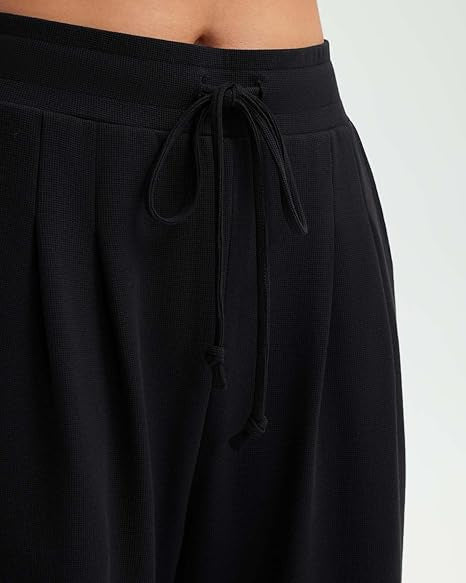 Uformelle baggy bukser for kvinner med knappdetaljer Skjora