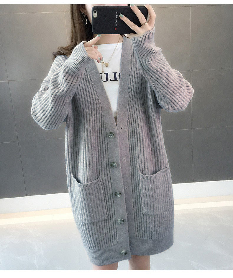 Dame cardigan med lappelommer og knappestolpe Skjora