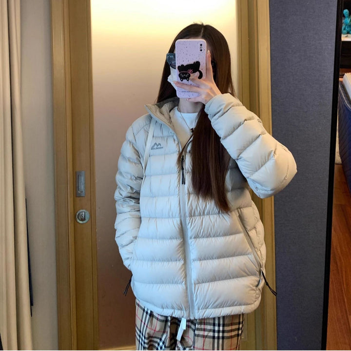 Kvinnes quilted vinterjakke med høy krage og praktiske sidelommer
