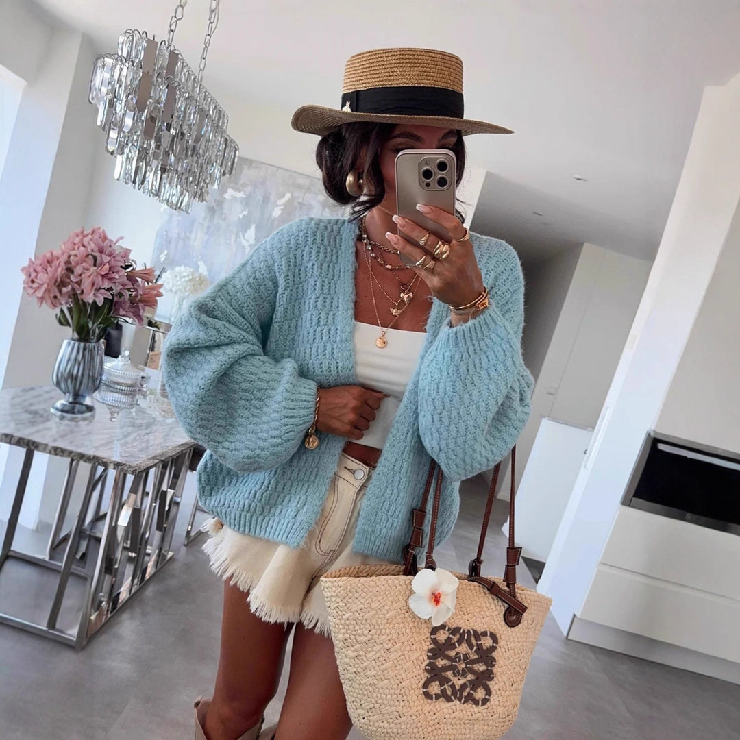 Kvinnes chunky strikk cardigan med voluminøse ermer og åpen front Skjora