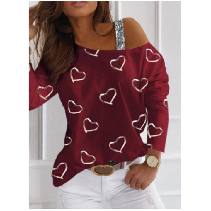 Kvinnelig motesweater med hjerteformet design og glitrende aksenter Skjora