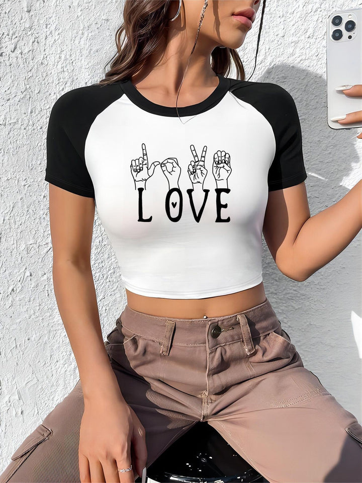 Dame crop-top med motiverende tekst og avslappet snitt Skjora