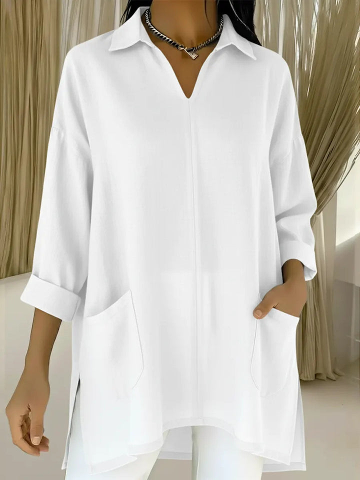 Dame langermet bluse med elegant V-hals og praktiske lommer Skjora