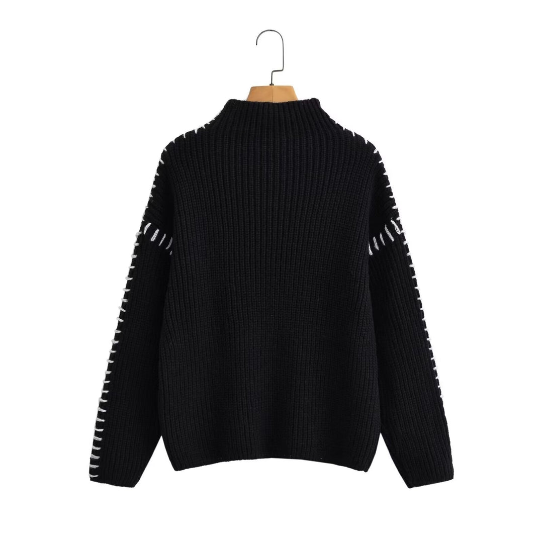 Kvinne chunky strikkegenser med høy krage og elegante erme detaljer Skjora
