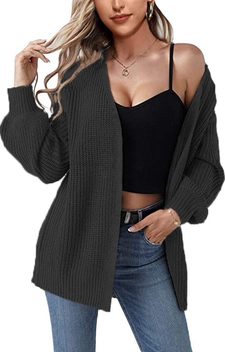 Kvinnens chunky strikket cardigan med en avslappet fasong og åpne masker Skjora