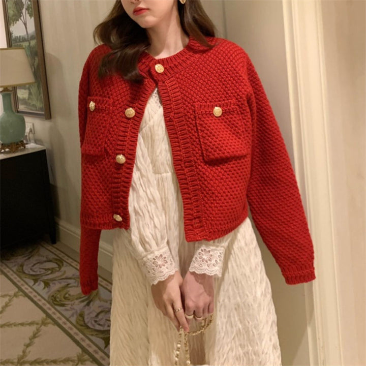 Dame cardigan med dekorative knapper og teksturert design Skjora