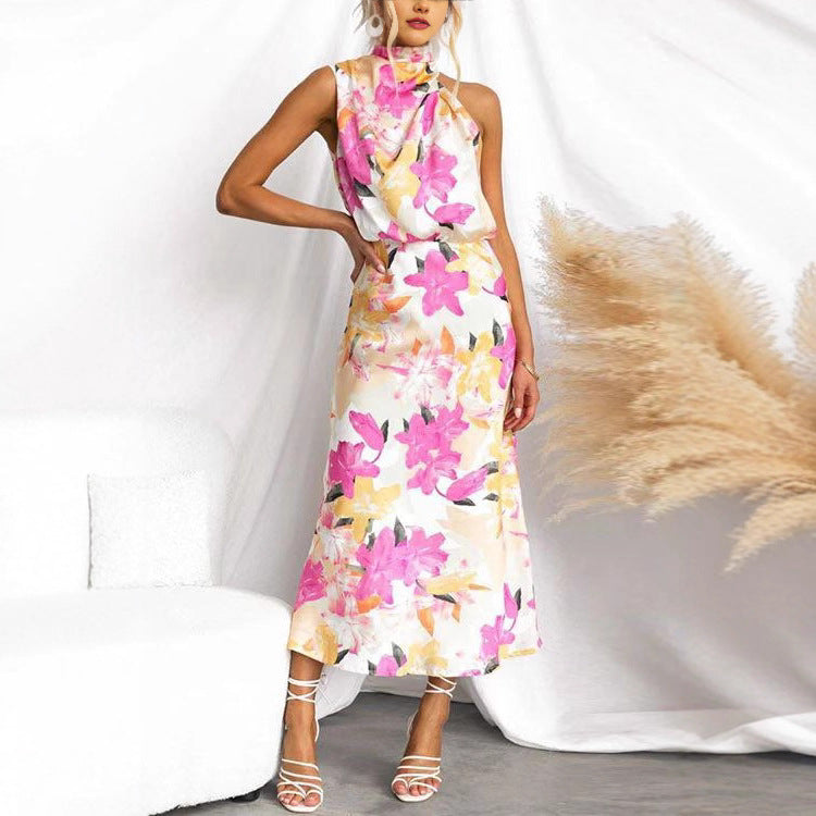 Kvinnens maxi kjole med asymmetrisk topp og blomsterprint Skjora