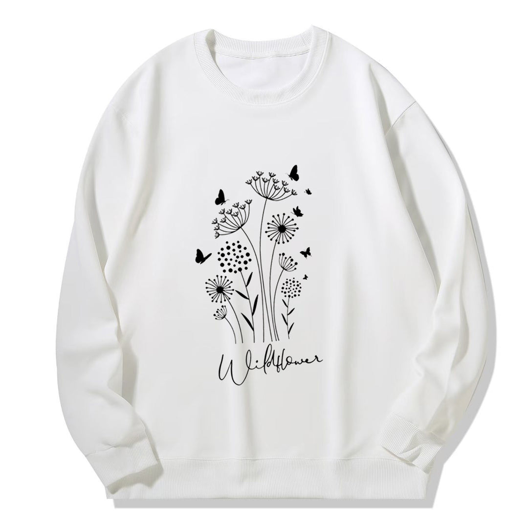 Kvinnelig sweatshirt med blomstertrykk av villblomster og koselig innerfor Skjora