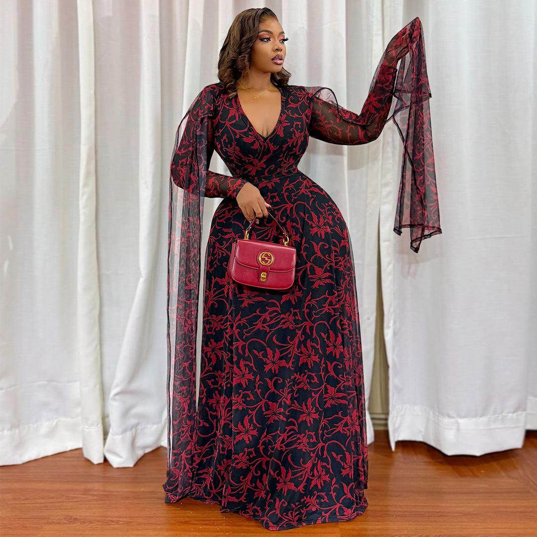 Kvinne maxi kjole med blomstrende transparent design og elegante ermer Skjora