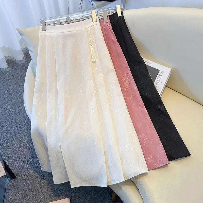 Damenes elegante midi skjørt med teksturert stoff og flytende snitt