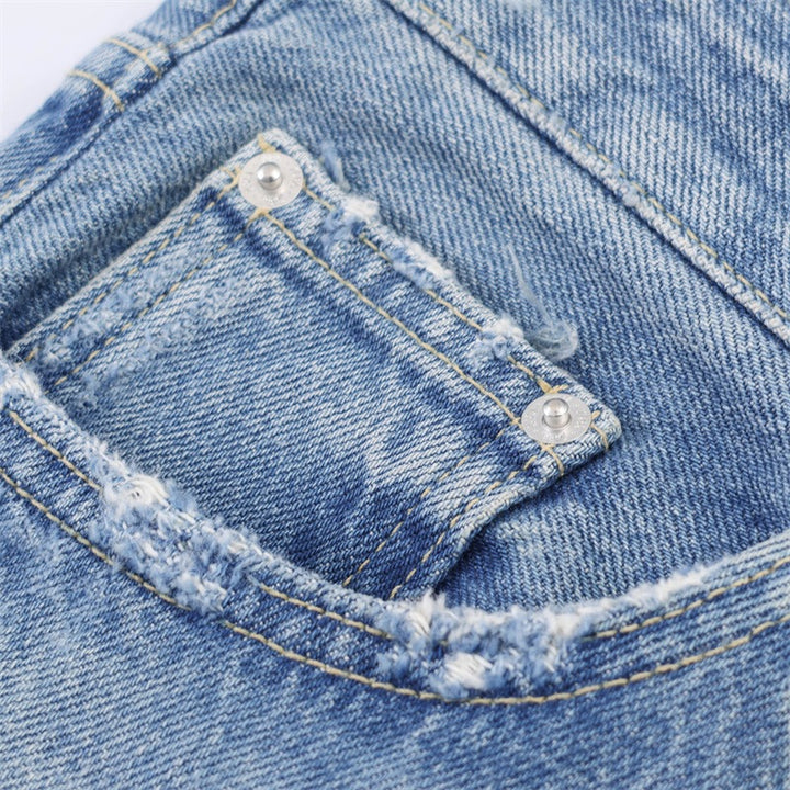 Dame Flared Jeans i brukt look med frynser og ødelagte detaljer Skjora