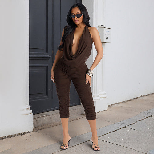Damer elegant og figursydd jumpsuit med dyp V-hals og draperinger Skjora