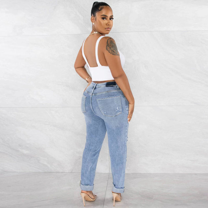 Kvinnenes høyhals boyfriend-jeans med frynsehem og casual brukt utseende Skjora
