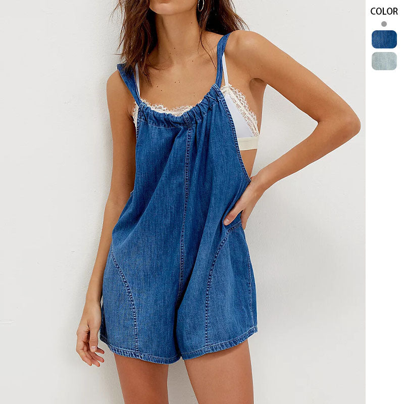 Kvinnenes denim jumpsuit med leken cut og justerbare stropper