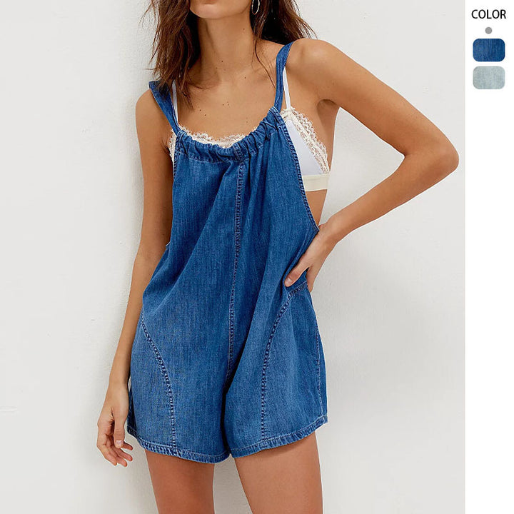 Kvinnenes denim jumpsuit med leken cut og justerbare stropper