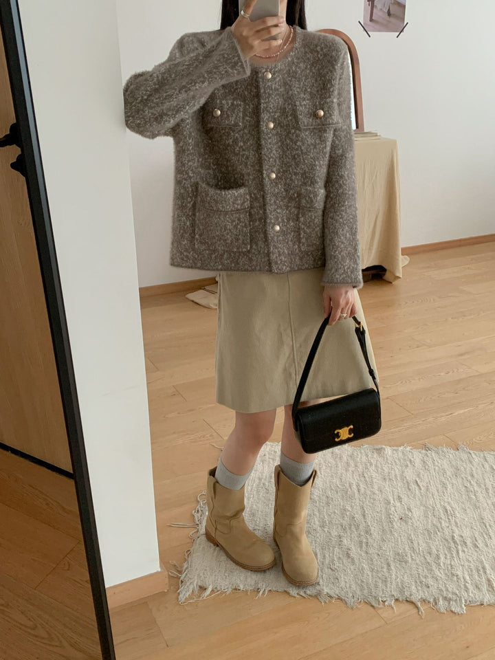 Kvinners koselige cardigan med knappe detaljer og lommeputer Skjora