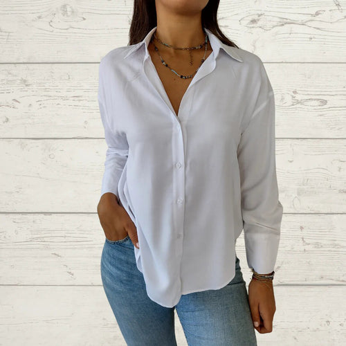 Dame elegant langermet bluse med fint stoff og feminine detaljer Skjora