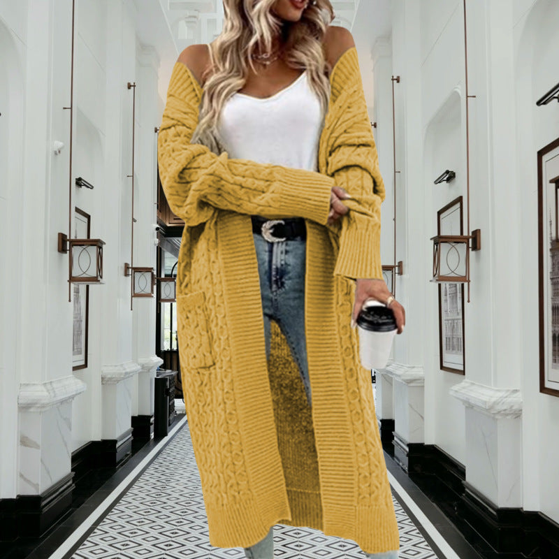Kvinnes chunky strikket cardigan med åpen design og praktiske lommer Skjora
