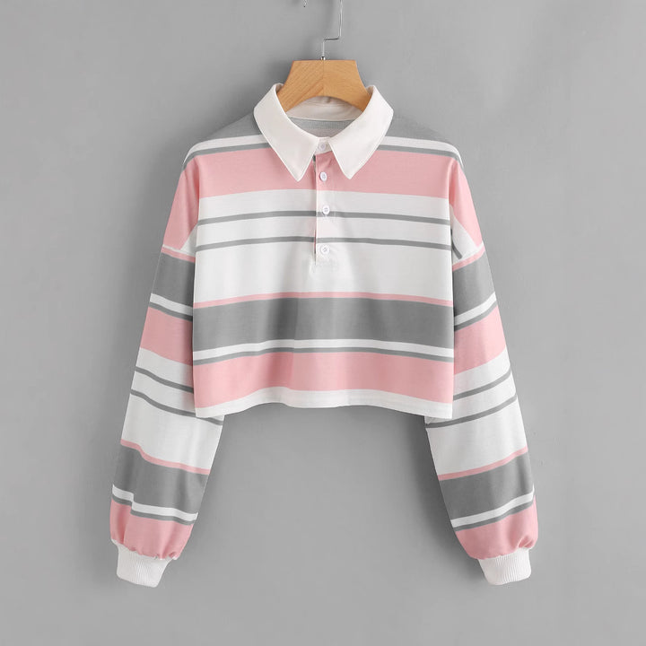 Dame polo skjorte i en avslappet crop design med et stilfullt fargeblokk mønster Skjora