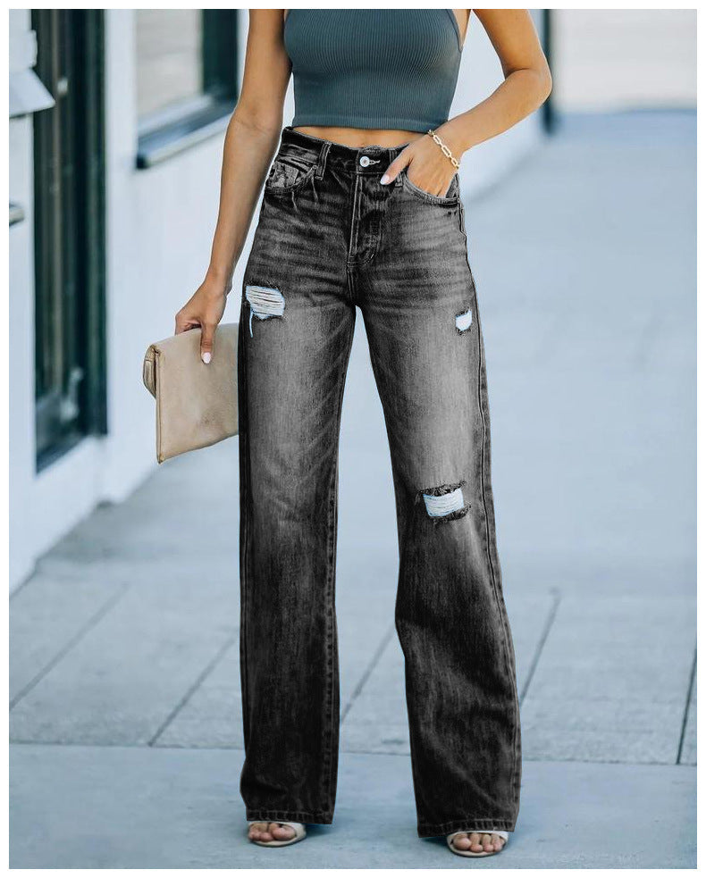 Kvinnelige vidde jeans med slitte effekter og høy liv