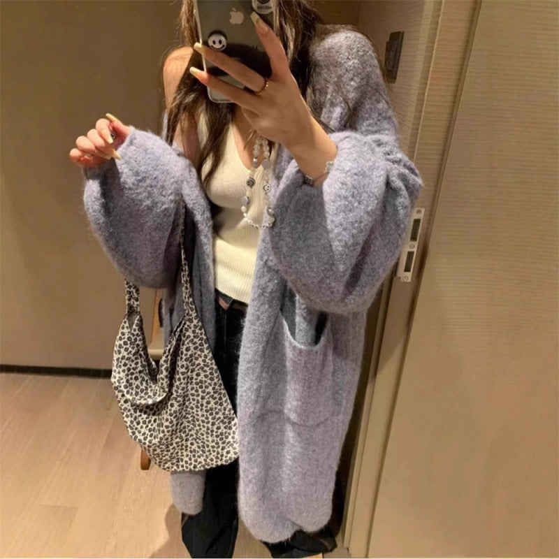 Kvinners fluffy cardigan med store lommer og løs passform Skjora