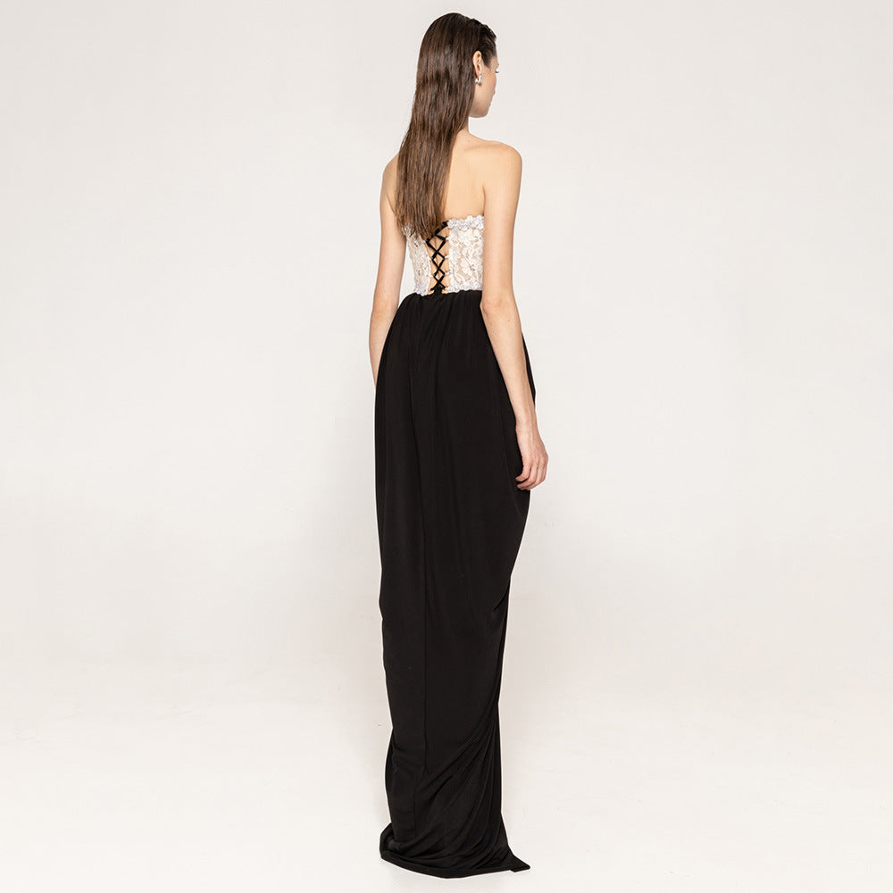 Women's elegant evening dress with glittery pointed top and draped skirt