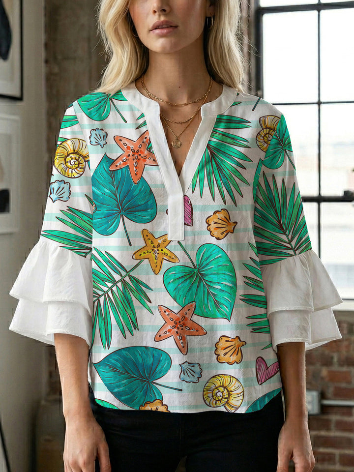 Dame bluse med voluminøse rysjermer og moderne motiv Skjora