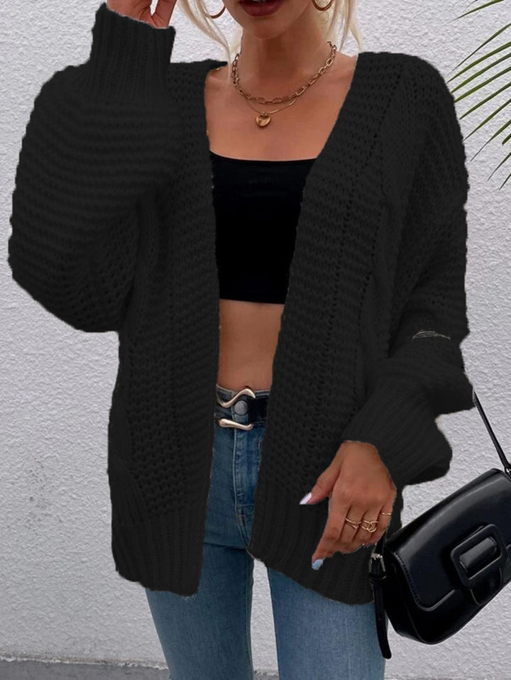Kvinnens chunky strikket cardigan med komfortable åpne lommer og avslappet passform Skjora