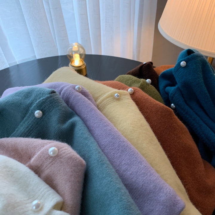 Dame cardigan med elegante perleknapper og moderne design Skjora